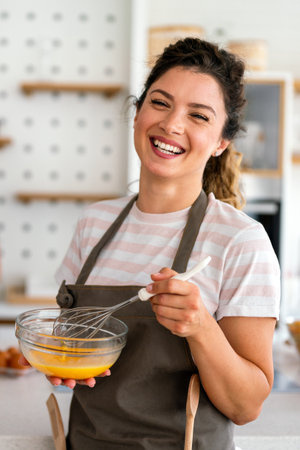 Professional success personal chef cook in customer private kitchen giving cooking lesson to peopleの写真素材