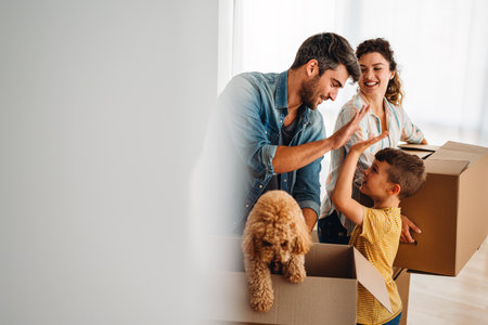 New home, box and parents with child in new house, property mortgage and real estate investment.の写真素材