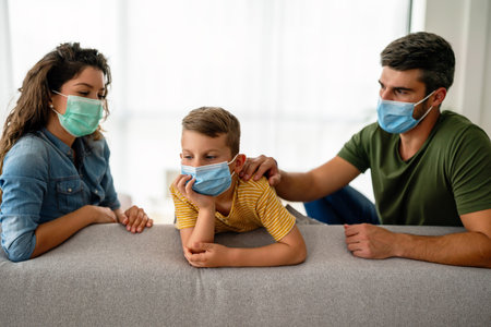 Sad family wearing protective medical mask for prevent virus, flu, pollution. Family protectionの写真素材