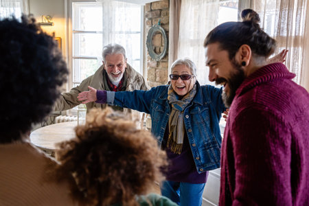 Happy multiethnic multi-generational family enjoying Christmas time together. People love concept.の写真素材