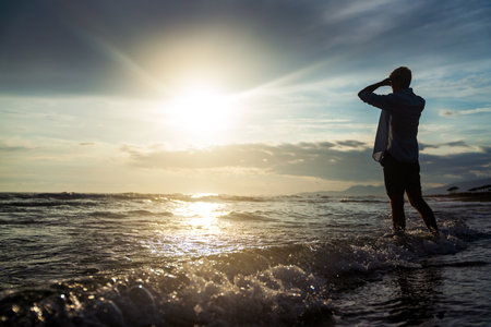 Smiling man on a tropical beach, enjoying his summer vacation. Travel people happiness concept
