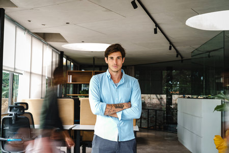 Young male startup ceo leader business man, success people standing in office.の写真素材