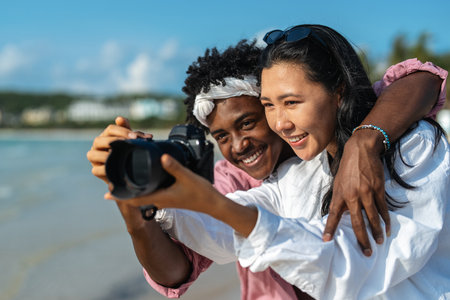 A young couple enjoying a romantic and joyful beach vacation, love, happiness, and deep connectionの写真素材