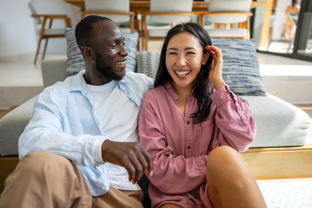 Happy diverse couple enjoying meaningful moments together, embracing love, connection, and joyの写真素材