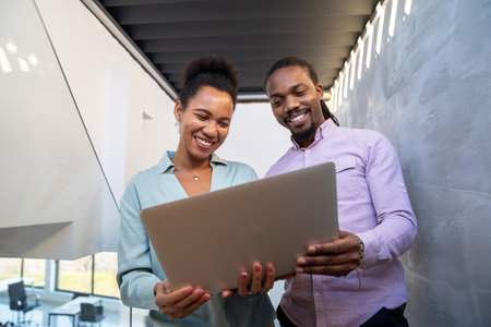 Artificial intelligence and technology development team using laptops, coding and smart solutionsの写真素材