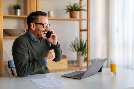 Young male employee, business man working in the office or remote work at homeの写真素材