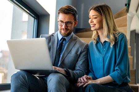 Group of young business people working as a team and communicating in corporate officeの写真素材