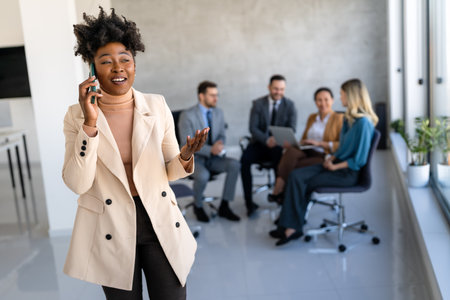 Successful executive standing proudly in office, representing business growth, partnershipの写真素材