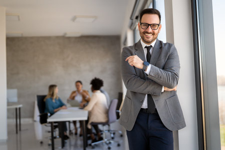 Multicultural professional businesspeople working together on research plan in boardroom.の写真素材