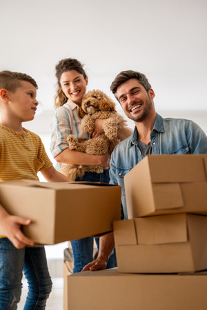 New home, box and parents with child in new house, property mortgage and real estate investment.の写真素材