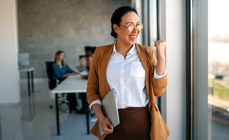 Confident business woman in modern office showcasing executive leadership, professional successの写真素材