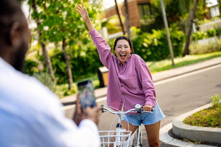 Interracial couple enjoying smartphone technology, staying connected, sharing moments. Travel peopleの写真素材