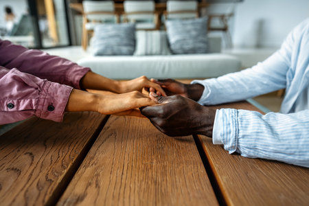 Handshake between people of different ethnicities, symbolizing trust, harmony, belonging, and unityの写真素材