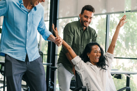 Happy diverse business team celebrating success and having fun all togetherの写真素材