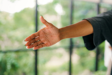 Happy office staff, success employee giving hand for shaking. Business people offering handshakeの写真素材