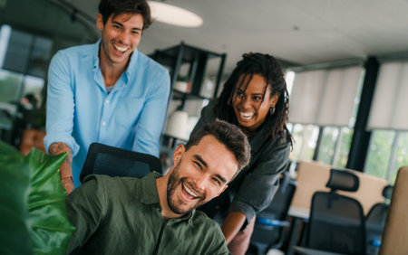 Group of young multiracial diverse office workers is caught in a moment of spontaneous joy.の写真素材
