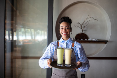 Young entrepreneur creating a successful dining experience with exceptional service, quality drinksの写真素材