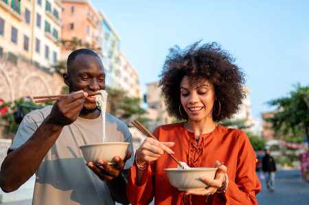 Portrait of a happy couple sharing a meal outdoors, focused on their joyful expressions, connection