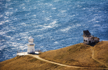 Lighthouse and abandoned radio-transmission near the lighthouse, Cape Meganom. City district Sudak, the Republic of Crimea.の写真素材