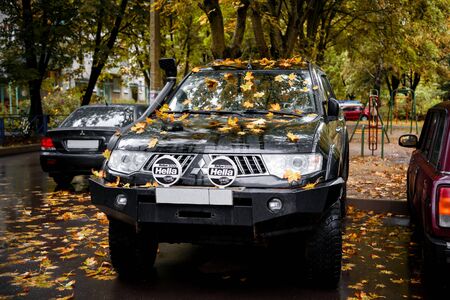 Parked Mitsubishi Pajero Sport in the maple leaves. Podolsk, Russia. September 16, 2018のeditorial素材