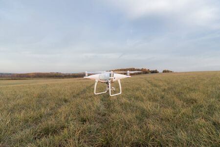 Demonstration flight drone DJI Phantom 4 Pro in the autumn forest. Moscow, Russia. October 12, 2018のeditorial素材
