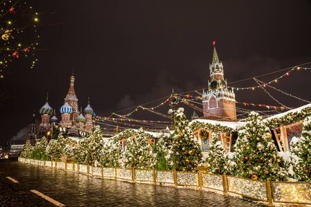 Red Square, Moscow, Russia - December 29, 2018: Spasskaya Tower and Cathedral of Vasily the Blessed....