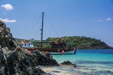 Neos Marmaras, Halkidiki, Greece - June 29, 2014: Tourist ship near the island in good sunny weather.のeditorial素材