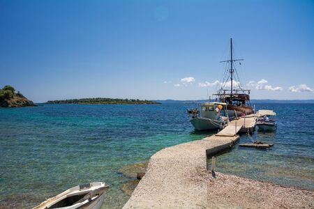 Neos Marmaras, Halkidiki, Greece - June 29, 2014: Tourist ship near the island in good sunny weather.のeditorial素材