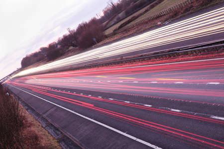 Car light trails on a motorway at duskの写真素材