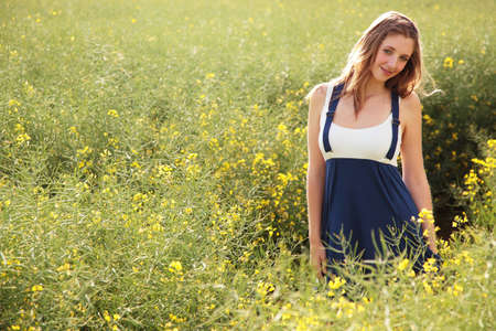 GIrl walking in fieldの写真素材