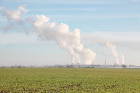 Plumes of smoke rising from a power plant