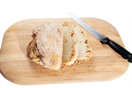 Home made bread on a beautiful wooden chopping boardの写真素材