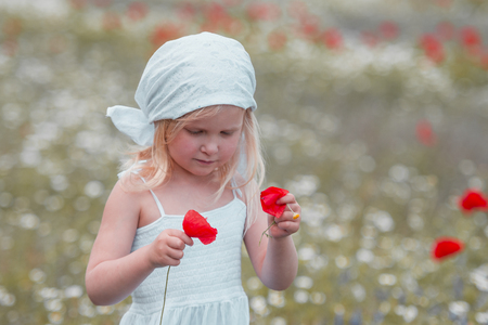 child in a flower fieldの写真素材
