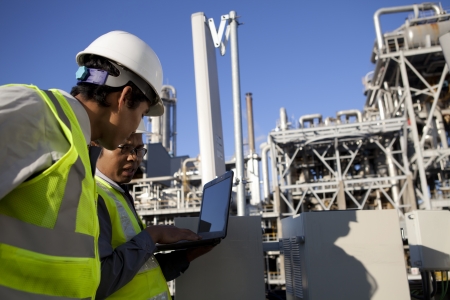 two engineer power and energy discussion on location siteの写真素材