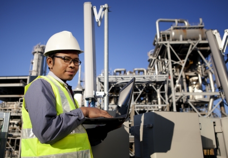 engineer power and energy using laptop on location siteの写真素材