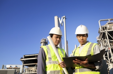 two engineer power and energy discussion on location site の写真素材