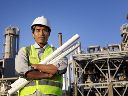 chemical industrial engineer with large oil refinery backgroundの写真素材