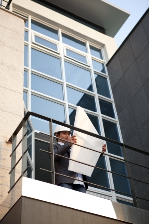 Developers looking over an office building choosing an appropriate construction site の写真素材