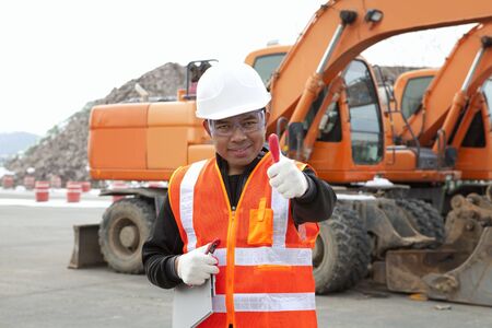 portrait of driver construction equipment showing thumb up smilingの写真素材