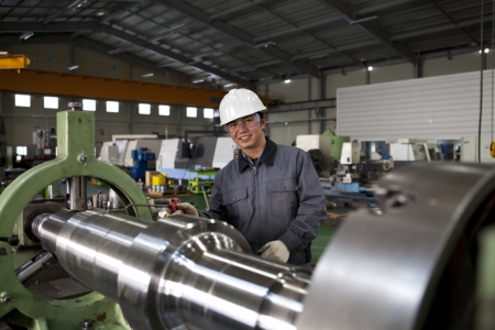 asia technician operative of cnc milling cutting machine center at tool workshop の写真素材