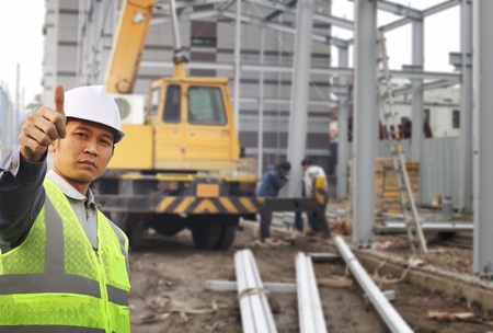 foreman construction site with construction background and worker