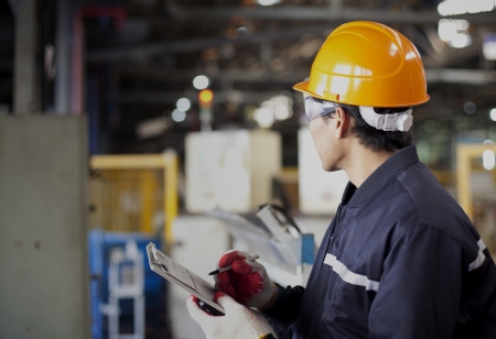 Portrait of asian engineer standing in the factory Portrait of asian engineer standing in the factory