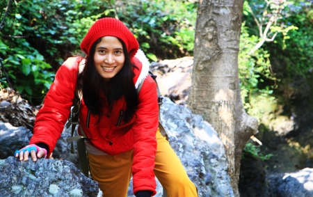 Woman backpacker on springの写真素材