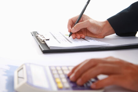Business concept of hand analyzing income earningsの写真素材