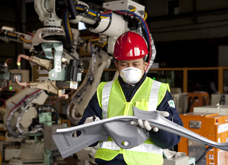 Industrial engineer checking quality metal productionの写真素材