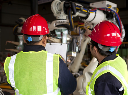 Foreman inspection in manufacturing factoryの写真素材