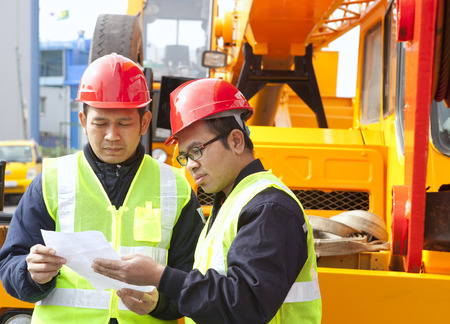 Construction workers discussing new project buildingの写真素材