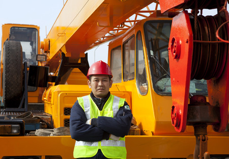 Construction worker with heavy equipment