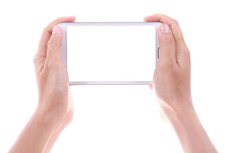 Female hand holding and showing blank smart phone isolated on white backgroundの写真素材