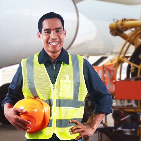 Portrait of asian professional engineer holding safety helmet at workの写真素材